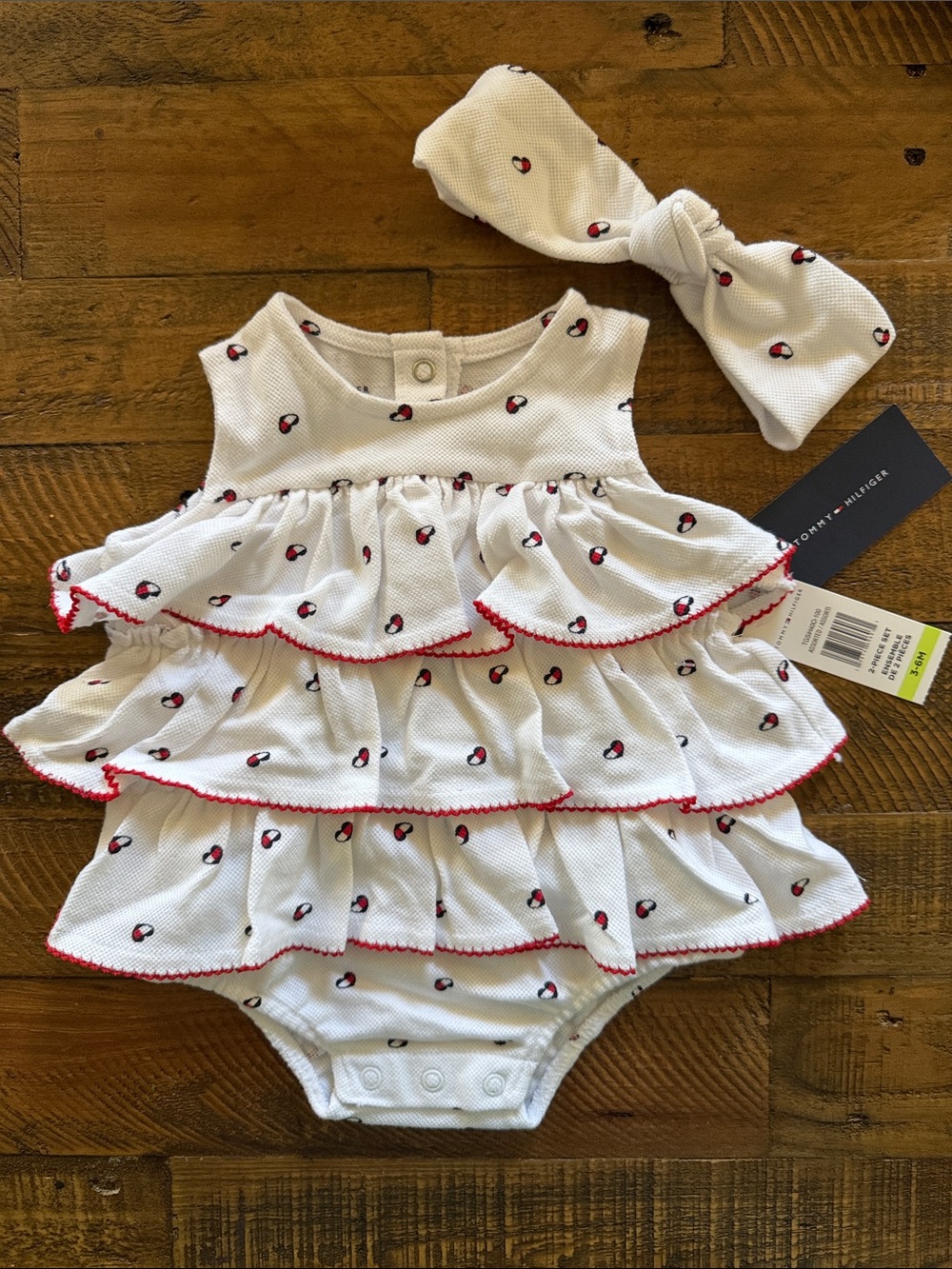 Tommy Hilfiger White Ruffle Baby Bodysuit with Red Trim and Tiny Navy-Red Motif